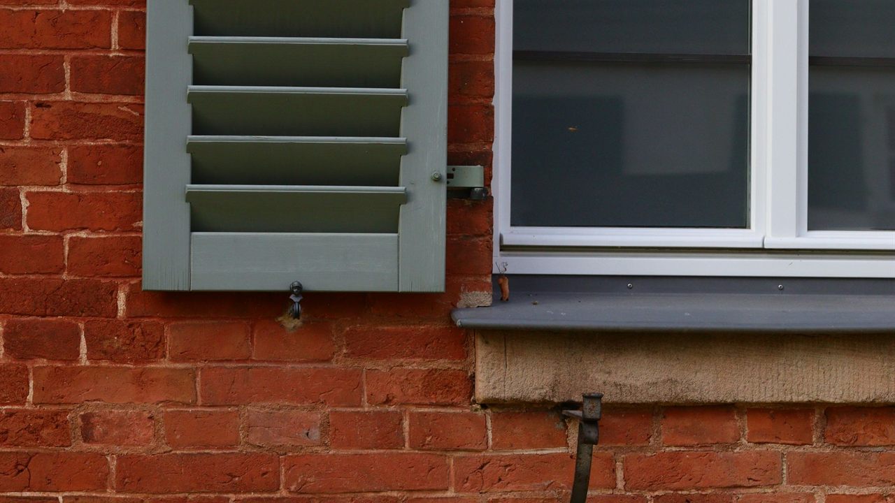 Closed window and shutter on a brick wall, a typical opening for a contact sensor