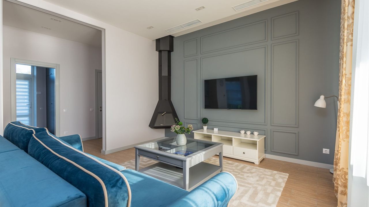 Wall-mounted TV in a living room, a typical small AV system