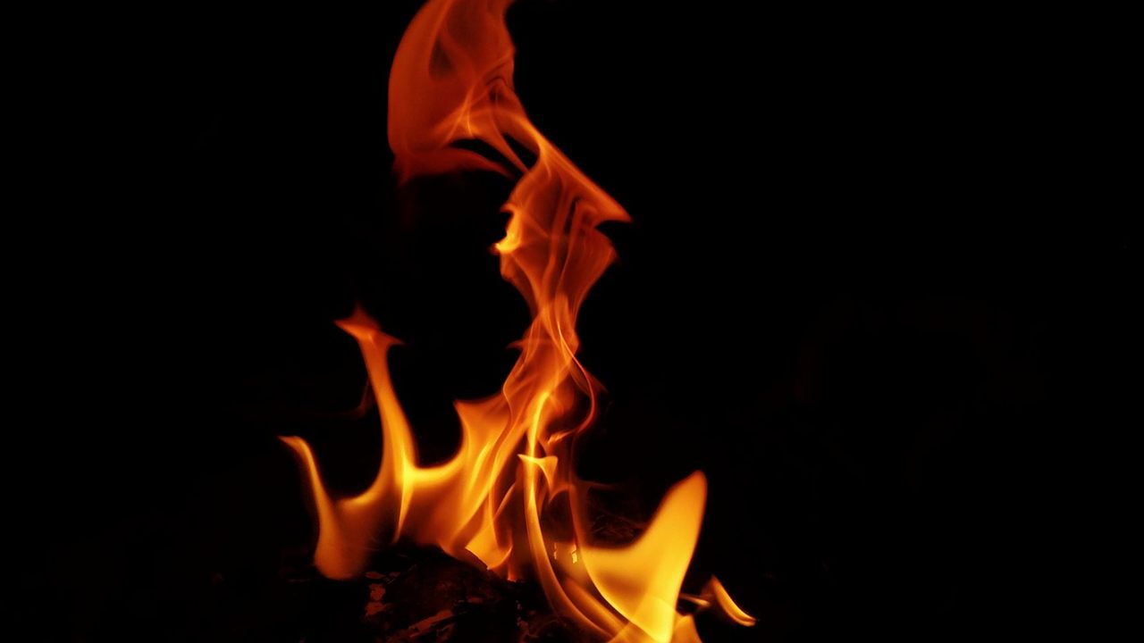 Orange flames rising against a black background