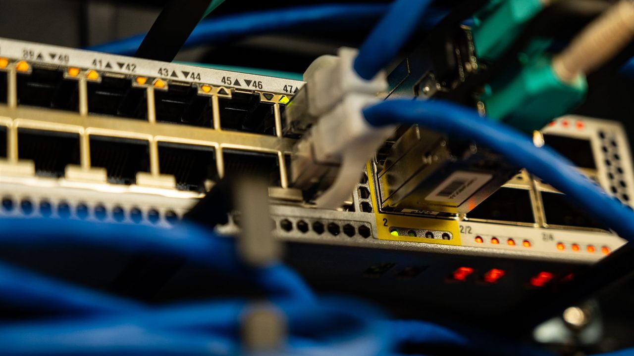Ethernet cables connected to a network switch, the power source for PoE IP cameras