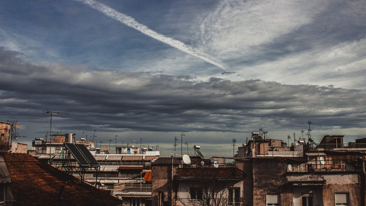 City rooftops with masts and antennas, the high points where a booster outside antenna belongs