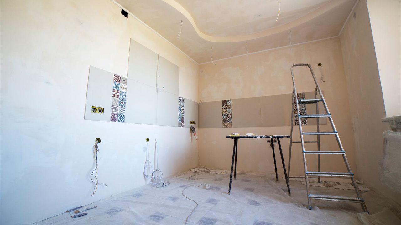 Room mid fit-out with a stepladder and cable drops from the ceiling, ready for the inside antenna