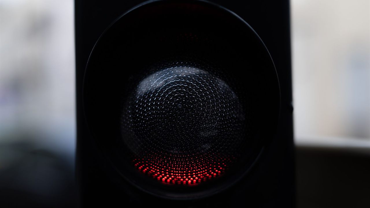 Cluster of small LEDs glowing behind a dark lens